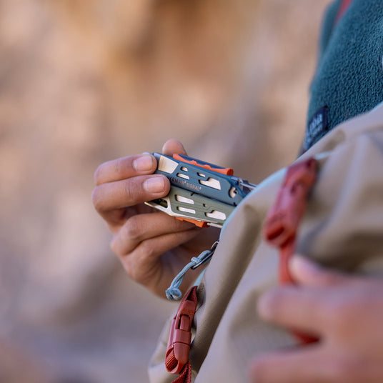 Translation missing: en.Leatherman Signal Tundrascape multi-tool stored in a backpack during a hike