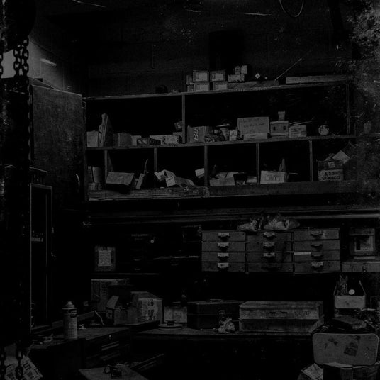 Translation missing: fr.Cluttered storage room with various boxes, containers, and items on shelves