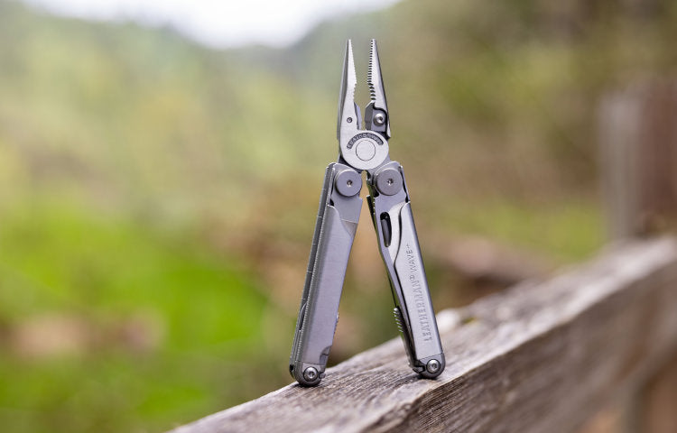 Leatherman Wave showing pliers on wooden fence