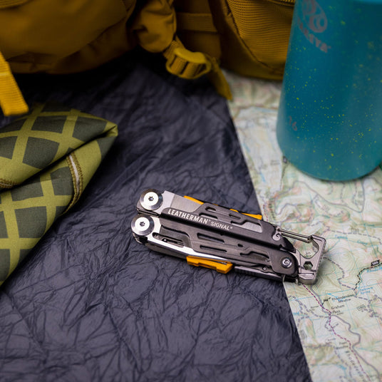 Leatherman Signal in a campsite on a map