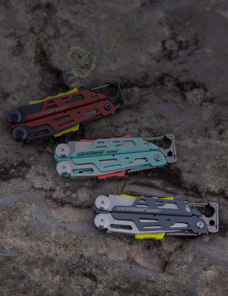 Leatherman Signal multi-tools in Aqua/Stainless, Grey/Stainless, and Red/Black Oxide colors