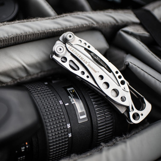 Closed Skeletool on top of a camera bag