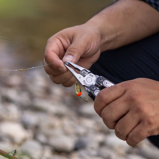 Man using ARC pliers to adjust a fishing line.