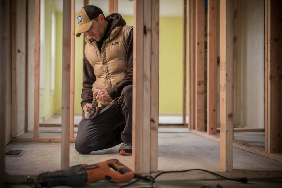 Construction person using Leatherman Wave+ bit to repair broken tool.