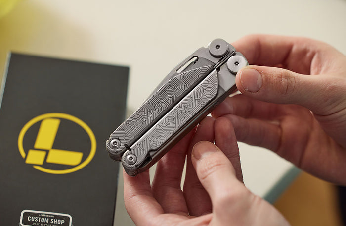 Translation missing: en.An individual holding a Leatherman Wave+ in their hand, indicating showing sleek custom design