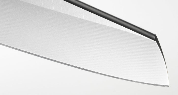 Translation missing: en.Close-up of a sharp kitchen knife blade on a white background, showcasing its sleek metal finish