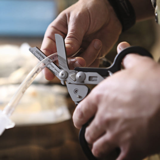 A person using Raptor to cut the tube.