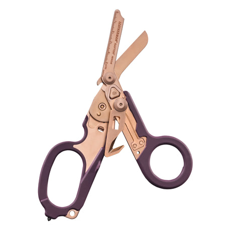 Translation missing: fr.Raptor® Rescue shears in Rose Gold with purple handles, shown open to display blades and integrated tools