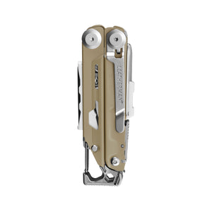 Translation missing: en.Folded beige and silver Leatherman Signal multitool with carabiner clip visible