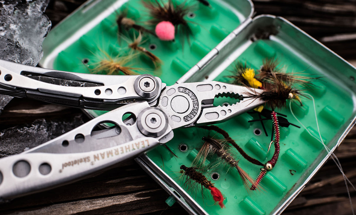 Translation missing: en.Skeletool pliers holding a fishing hook