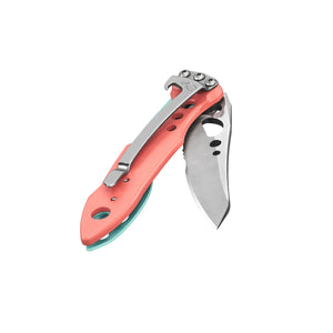 Translation missing: en.Skeletool KBX folding knife in Paradise color with partially open blade and pocket clip